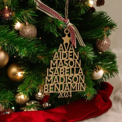 Personalized family-names tree ornament hanging on a decorated Christmas tree